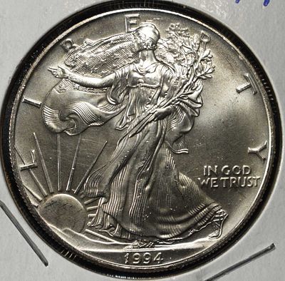 1994 AMERICAN SILVER EAGLE. BID WITH SILVER CITY AUCTIONS ESTIMATE $100 - $150.