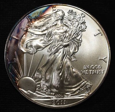 2011 AMERICAN SILVER EAGLE. CHECK OUT OUR UPCOMING AUCTIONS ESTIMATE $90 - $130.