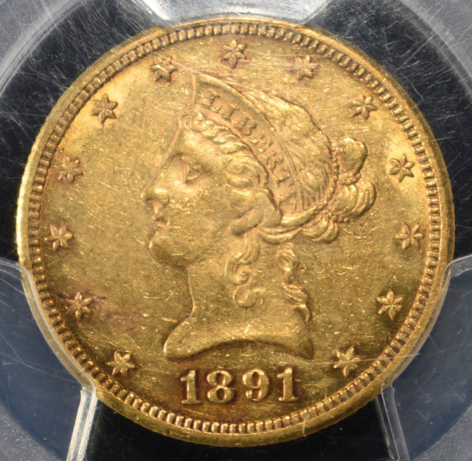 1891-CC $10 GOLD LIBERTY PCGS AU-53