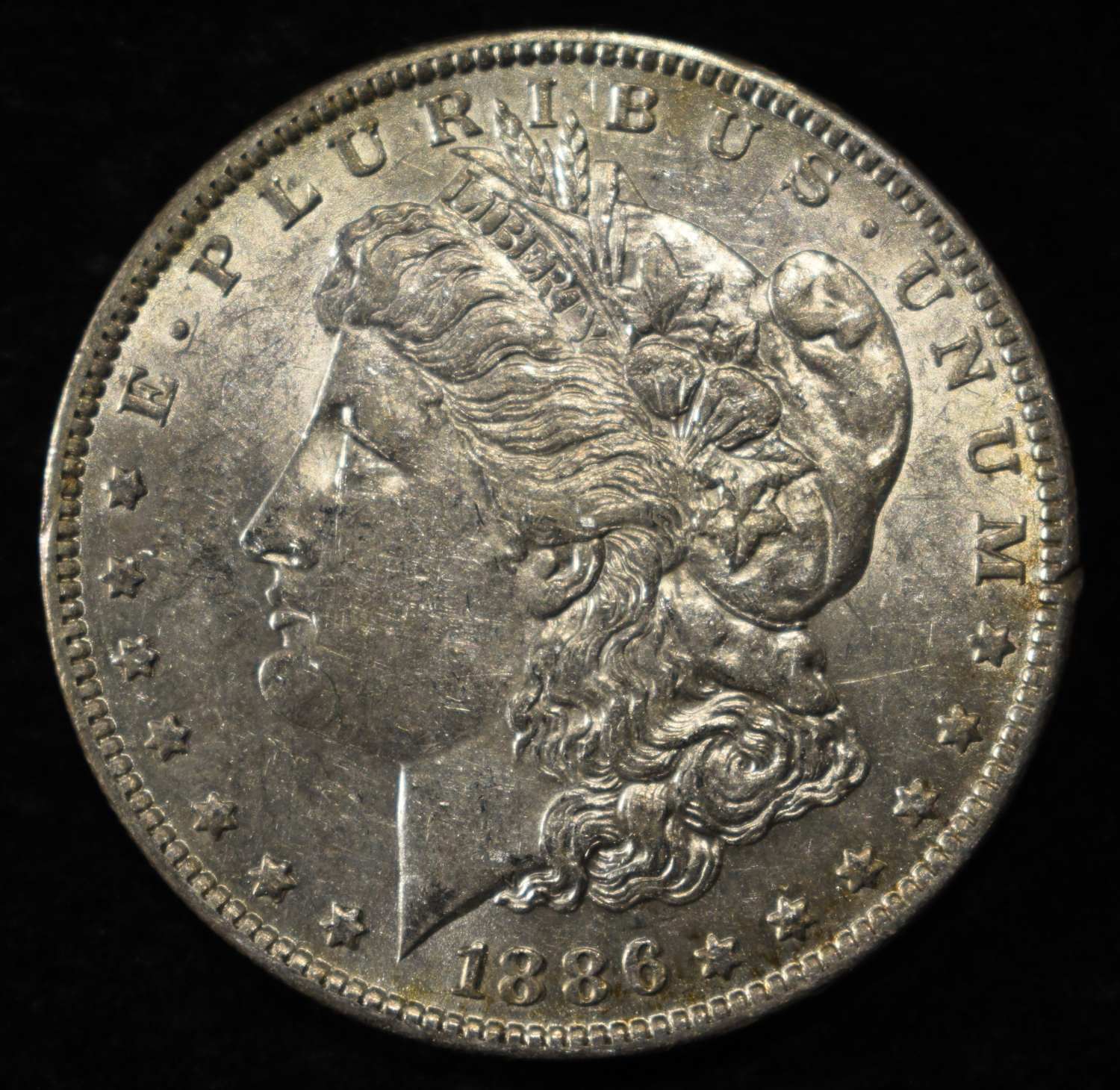 1886-O MORGAN DOLLAR AU