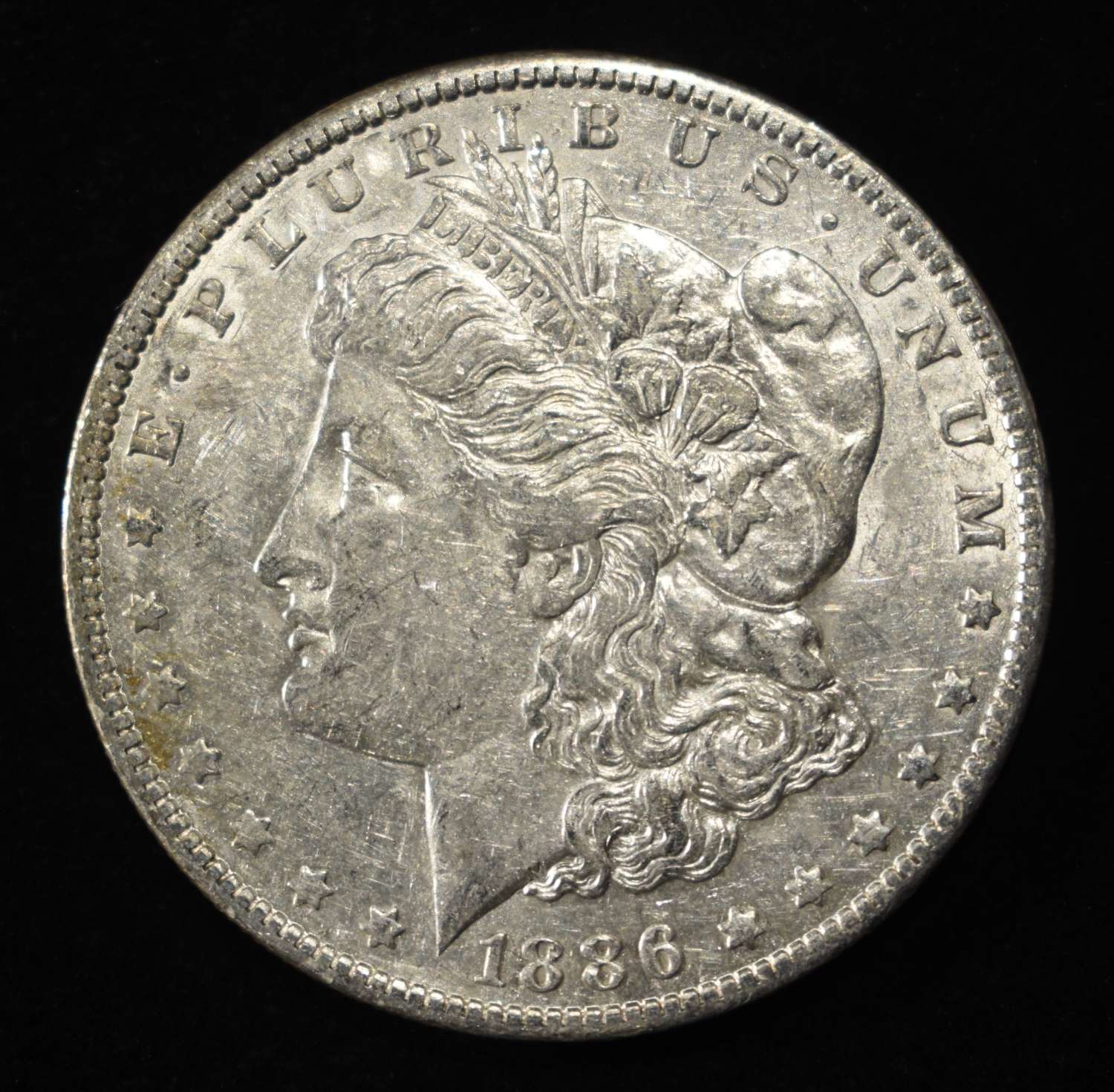 1886-O MORGAN DOLLAR AU