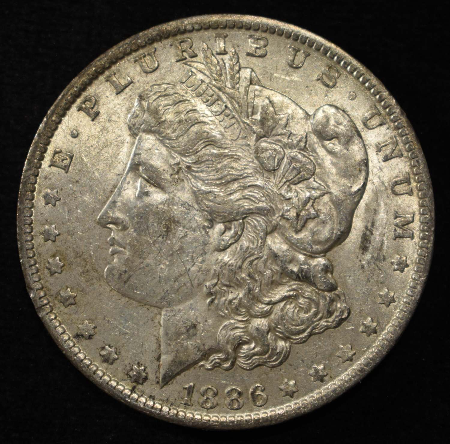 1886-O MORGAN DOLLAR AU