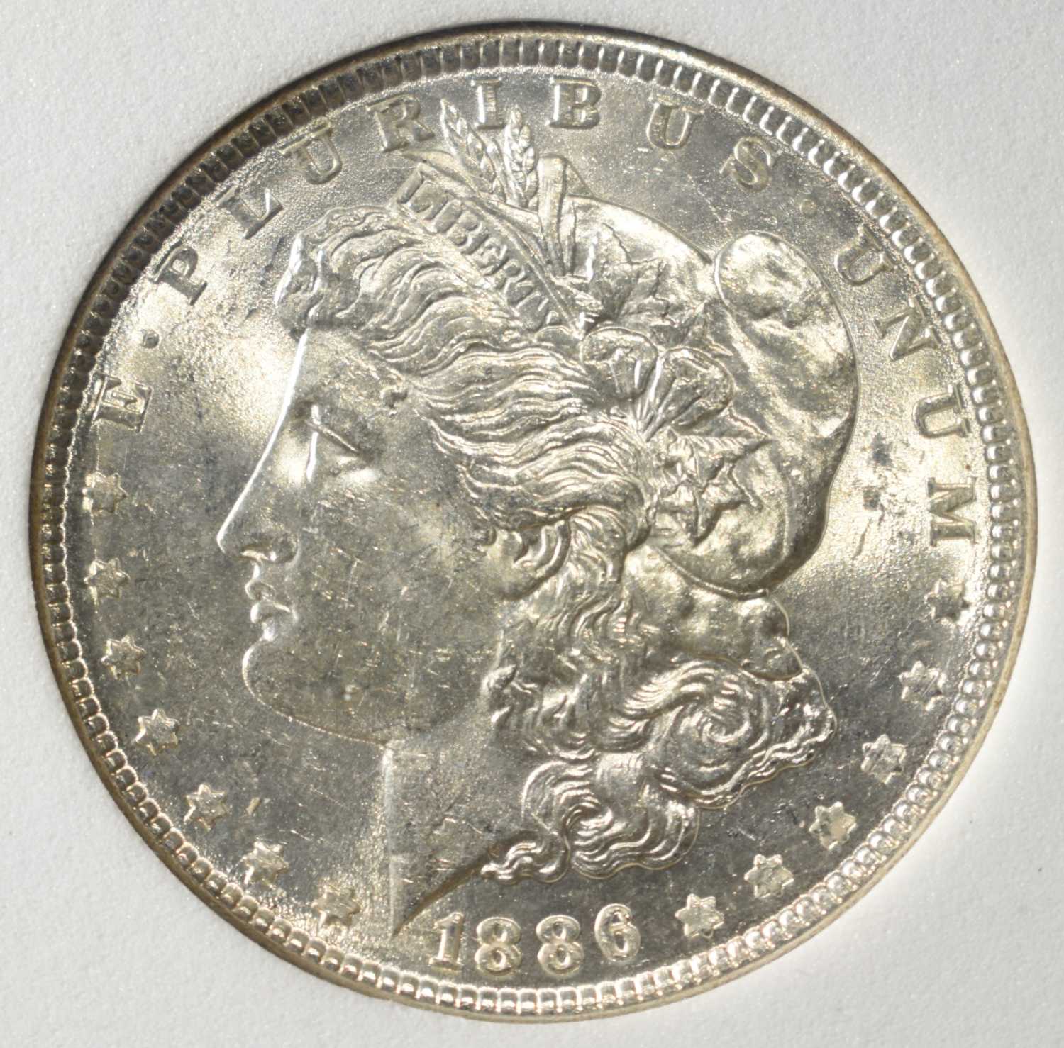1886 MORGAN DOLLAR WCG SUPERB GEM BU