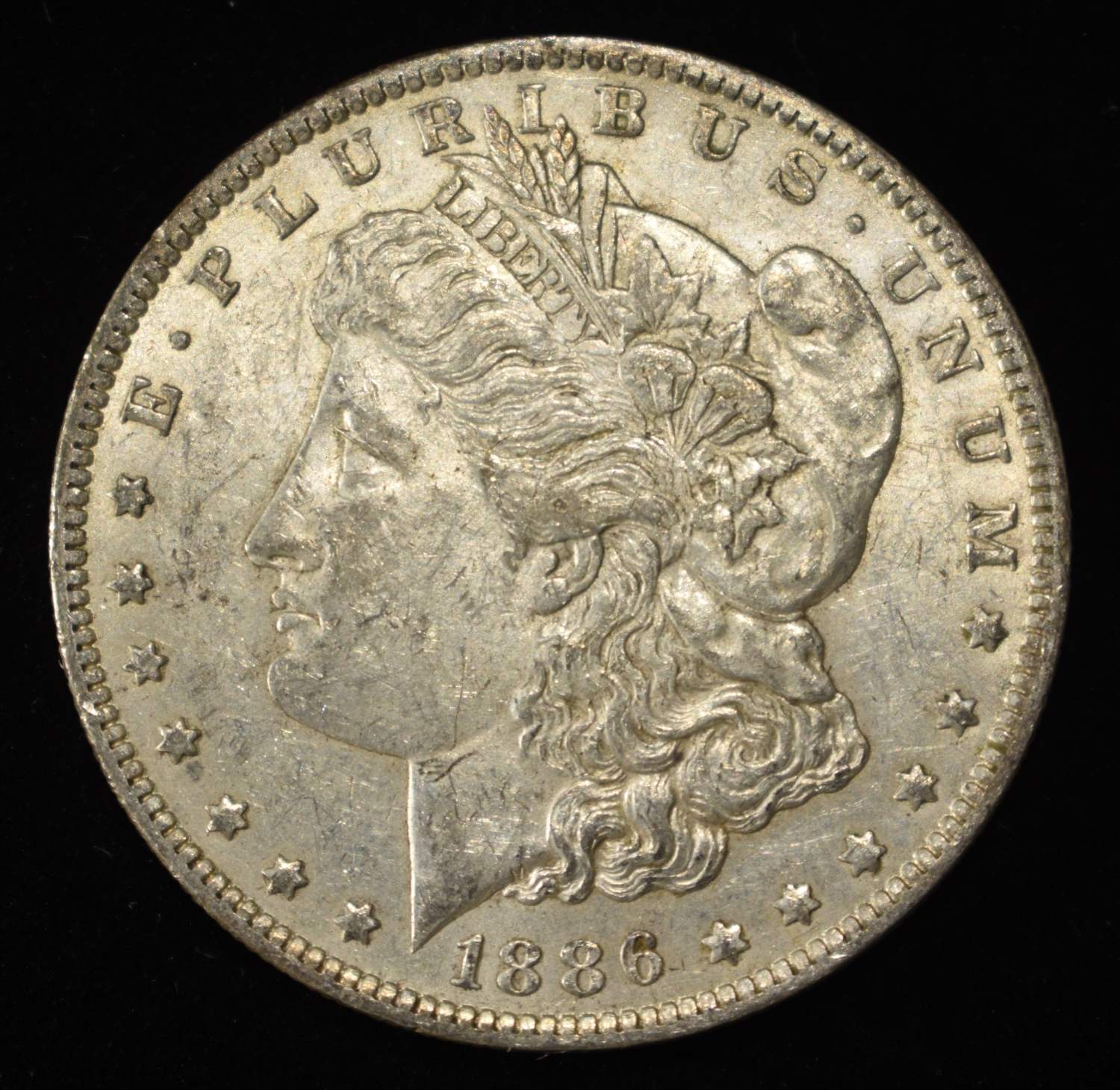 1886-O MORGAN DOLLAR AU