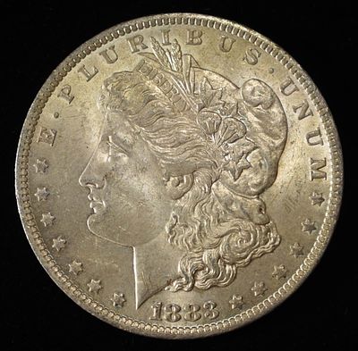 1883-O MORGAN DOLLAR. BID WITH SILVER CITY AUCTIONS ESTIMATE $75 - $100.
