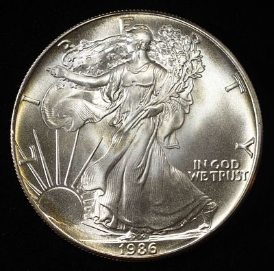 1986 AMERICAN SILVER EAGLE. TOP RATED AUCTION HOUSE ESTIMATE $100 - $150.