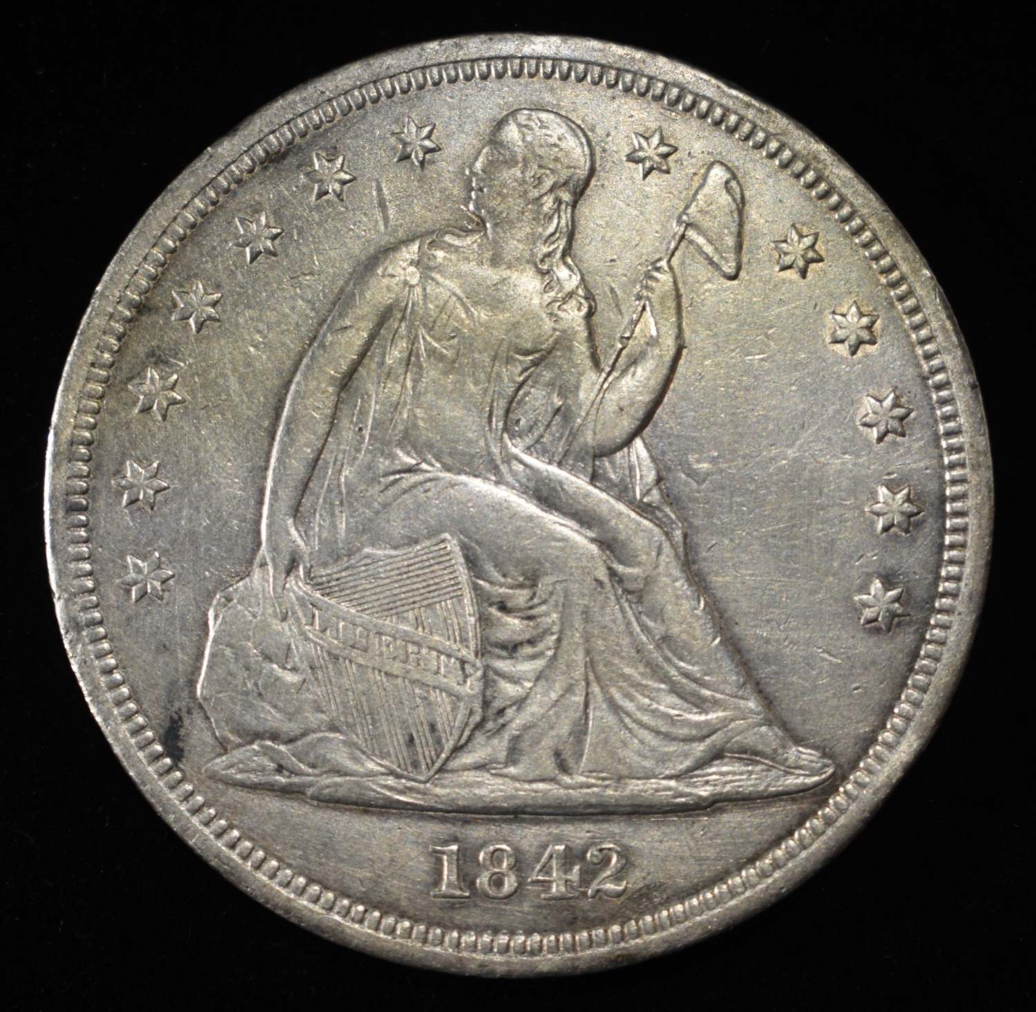 1842 SEATED DOLLAR VF/XF