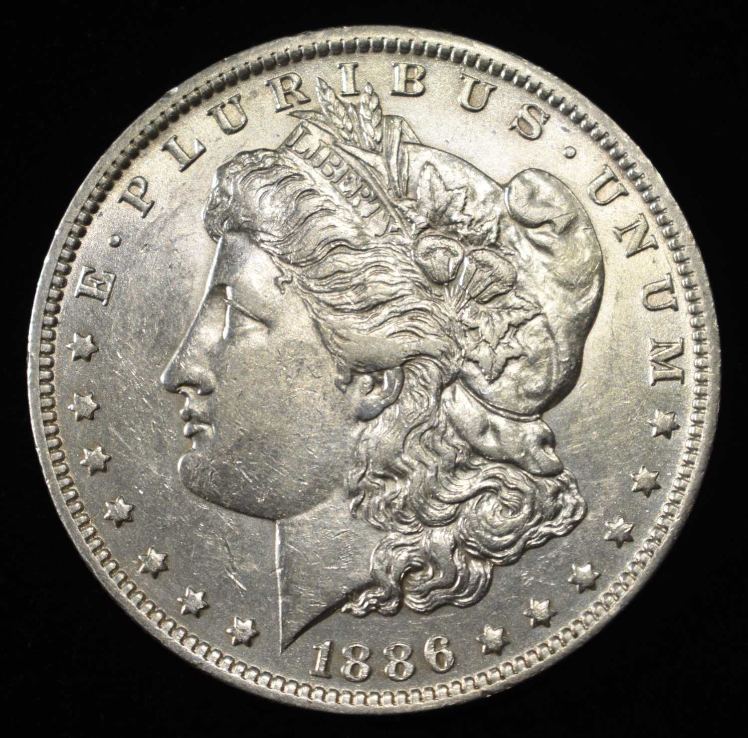 1886-O MORGAN DOLLAR AU