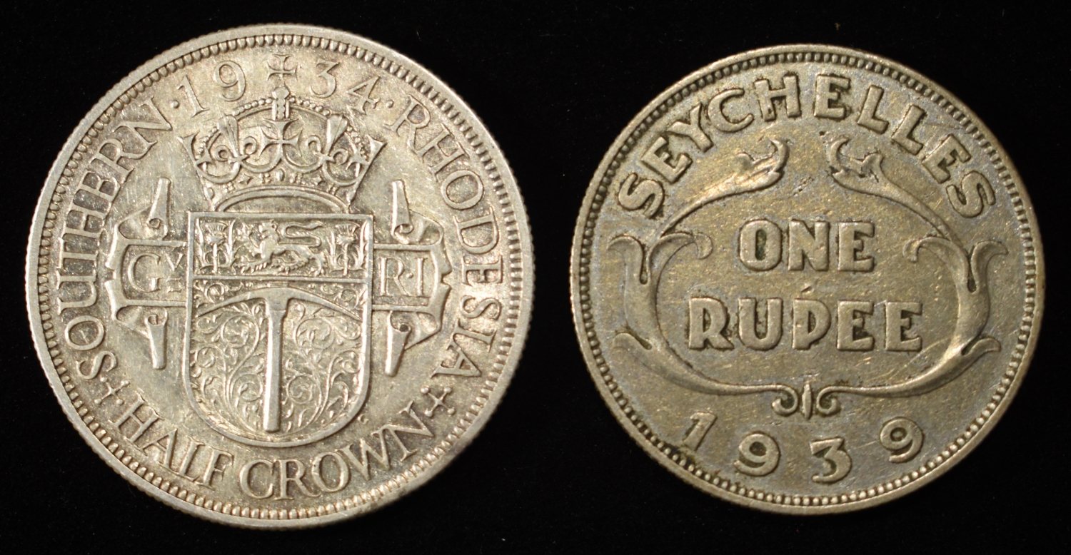 (2) FOREIGN SILVER COINS