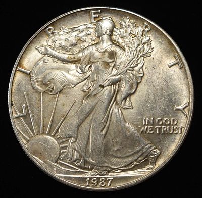 1987 AMERICAN SILVER EAGLE. WEEKLY COIN & CURRENCY AUCTIONS ESTIMATE $100 - $150.