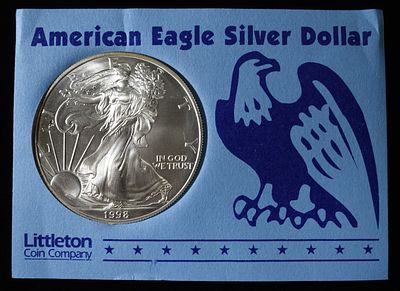 1998 AMERICAN SILVER EAGLE. WEEKLY COIN & CURRENCY AUCTIONS ESTIMATE $100 - $150.