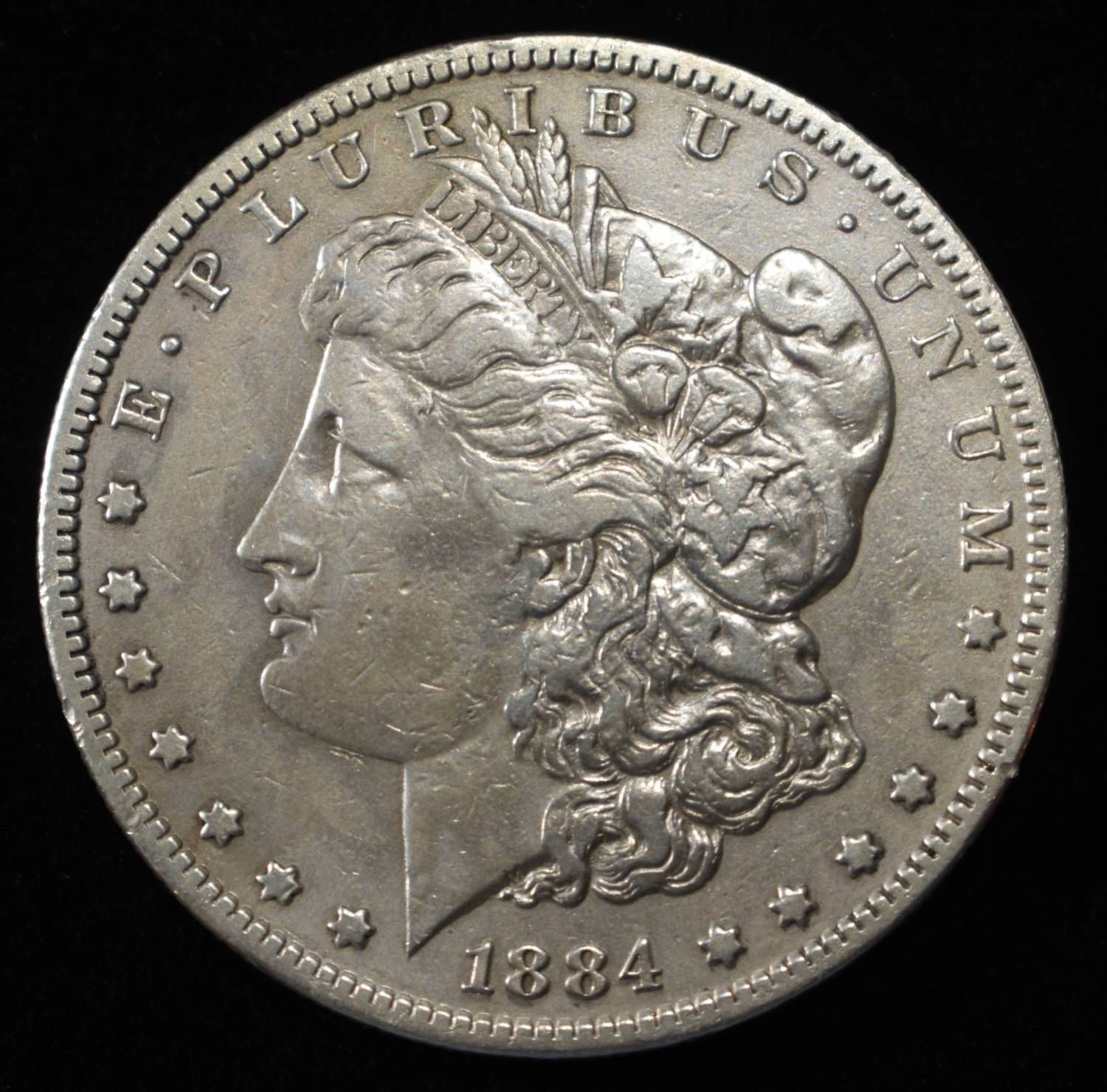 1884-S MORGAN DOLLAR AU