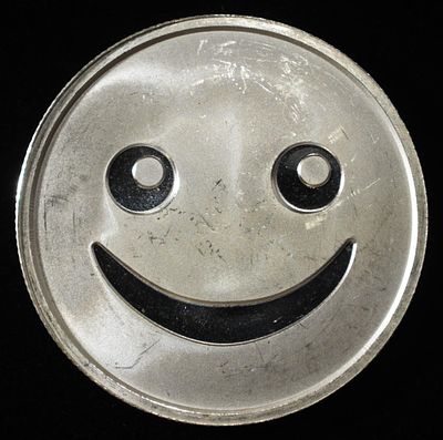 EMOJIS 1 OZ .999 SILVER ROUND. BID WITH SILVER CITY AUCTIONS ESTIMATE $100 - $150.