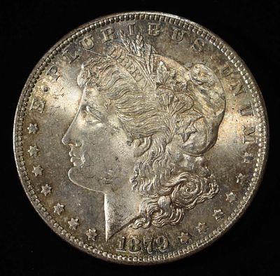 1879-O MORGAN DOLLAR. TOP RATED AUCTION HOUSE ESTIMATE $90 - $130.