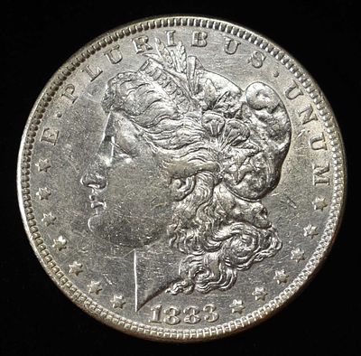 1883 MORGAN DOLLAR. TOP RATED AUCTION HOUSE ESTIMATE $90 - $130.