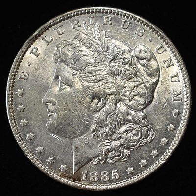 1885 MORGAN DOLLAR. CHECK OUT OUR UPCOMING AUCTIONS ESTIMATE $90 - $130.