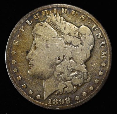 1898-S MORGAN DOLLAR. TOP RATED AUCTION HOUSE ESTIMATE $90 - $130.