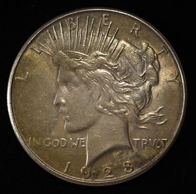 1928-S PEACE DOLLAR AU. CHECK OUT OUR UPCOMING AUCTIONS ESTIMATE $120 - $150.