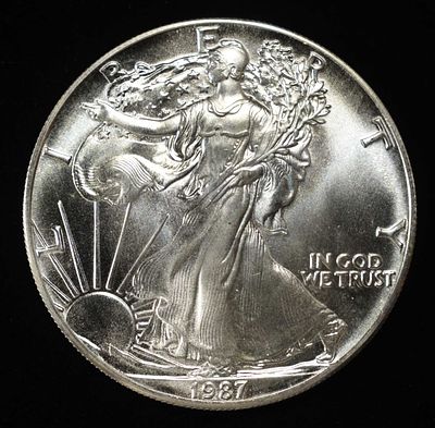 1987 AMERICAN SILVER EAGLE. LEADERS IN ON-LINE AUCTIONS ESTIMATE $100 - $150.