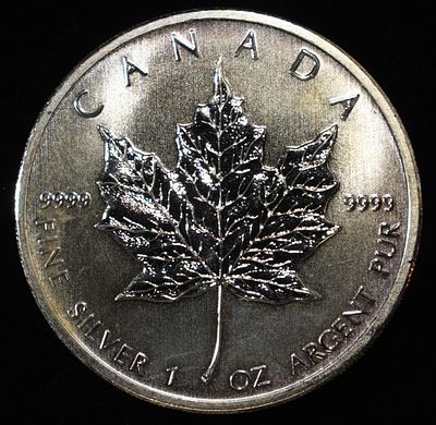 2011 MAPLE LEAF 1 OZ .999 SILVER ROUND. CHECK OUT OUR UPCOMING AUCTIONS ESTIMATE $120 - $170.