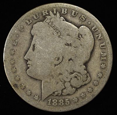 1885 MORGAN DOLLAR. BID WITH SILVER CITY AUCTIONS ESTIMATE $75 - $100.