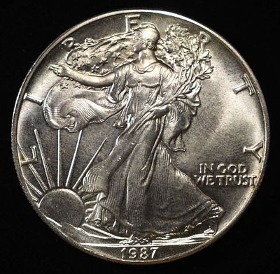 1987 AMERICAN SILVER EAGLE. WEEKLY COIN & CURRENCY AUCTIONS ESTIMATE $100 - $150.