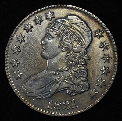 1831 CAPPED BUST HALF DOLLAR UNC LOVELY TONED. TOP RATED AUCTION HOUSE ESTIMATE $1150 - $1550.