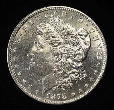 1878 7TF REV 78 MORGAN DOLLAR BU. CHECK OUT OUR UPCOMING AUCTIONS ESTIMATE $150 - $200.