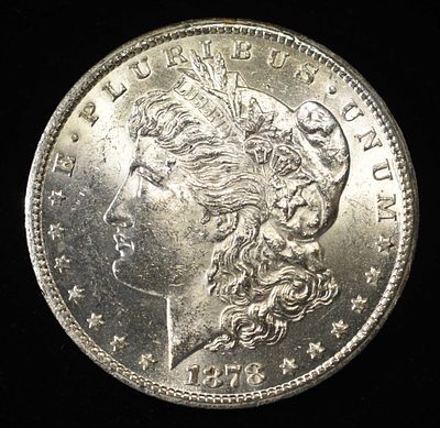 1878-CC MORGAN DOLLAR BU. CHECK OUT OUR UPCOMING AUCTIONS ESTIMATE $500 - $600.