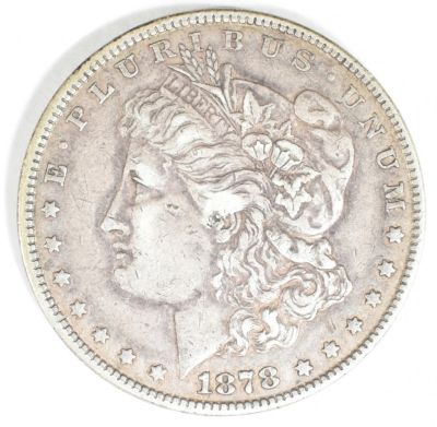 1878 7 TF MORGAN DOLLAR XF. CHECK OUT OUR UPCOMING AUCTIONS ESTIMATE $60 - $80.