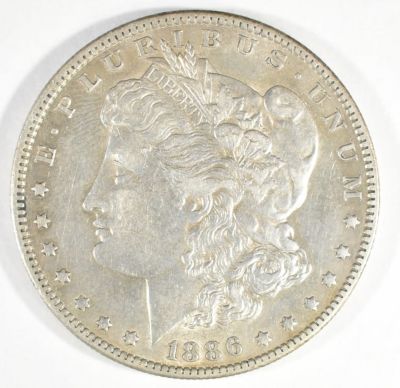 1886-O MORGAN DOLLAR AU. TOP RATED AUCTION HOUSE ESTIMATE $150 - $200.