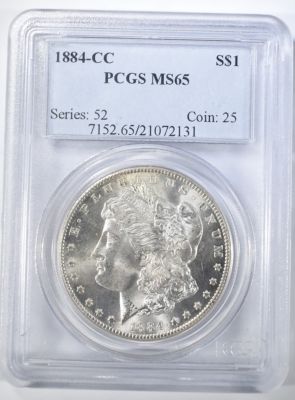 1884-CC MORGAN DOLLAR PCGS MS-65. TOP RATED AUCTION HOUSE ESTIMATE $600 - $700.