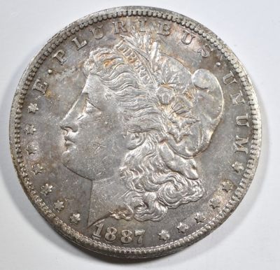 1887-S MORGAN DOLLAR AU/BU. CHECK OUT OUR UPCOMING AUCTIONS ESTIMATE $130 - $150.