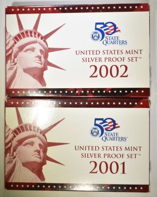 2001 & 2002 U.S SILVER PROOF SETS ORIG PACKAGING. BID WITH SILVER CITY AUCTIONS ESTIMATE $85 - $100.