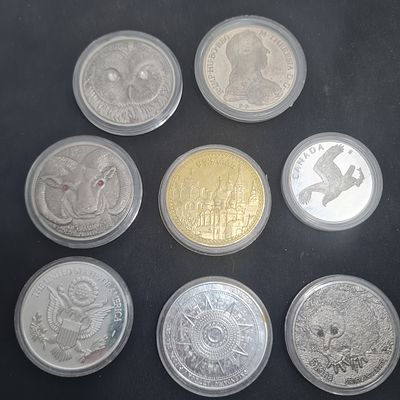 8 מטבעות אספנות מיוחדים בקפסולות, ככל הנראה רפליקות לא מכסף