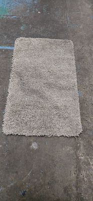 beige rubber backed new small rug 39 x 24