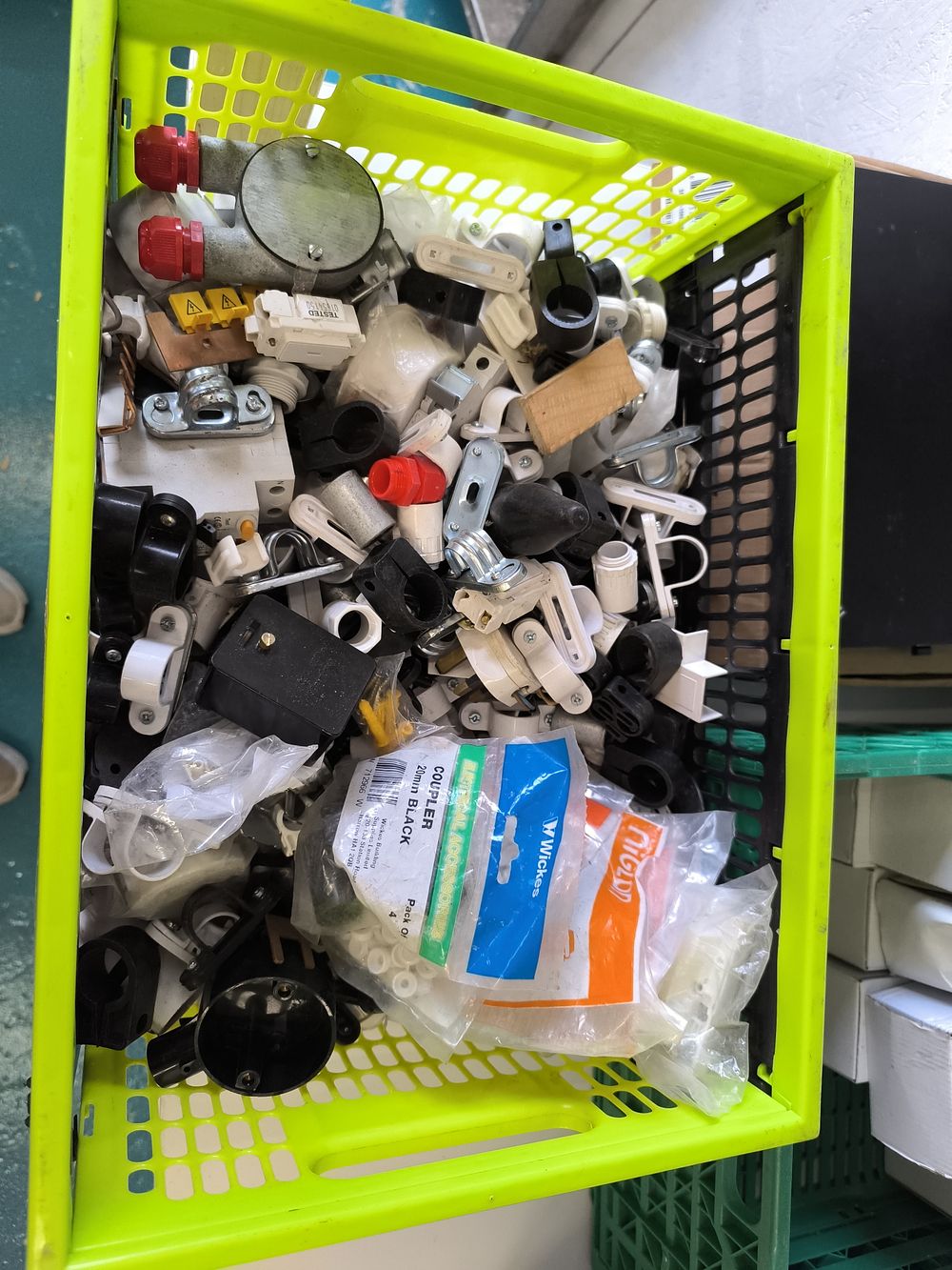 A Large Lot of Assorted Electrical, Plumbing, and DIY Components in a Utility Crate. A large lot 