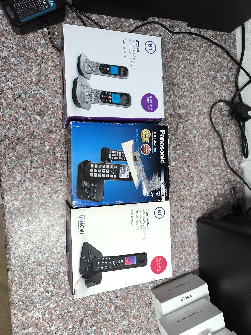 A Group of Used Cordless Telephone Systems and Smartwatches. A group of used consumer 