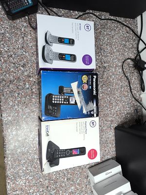 A Group of Used Cordless Telephone Systems and Smartwatches. A group of used consumer 
