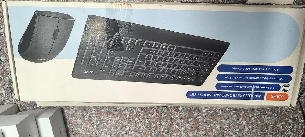Three Logik Wireless Keyboard and Mouse Sets, each contained within its original retail 