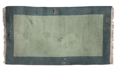 Nepalese rug, green, blue and polychrome decoration. Measures 1.55 x 0.88 meters.