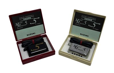 2 Suzuki Harmonicas.