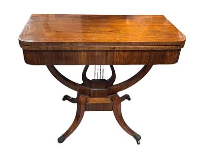 Game table with a lift-up top, Empire style, made of mahogany veneer, decorated with a lyre and 