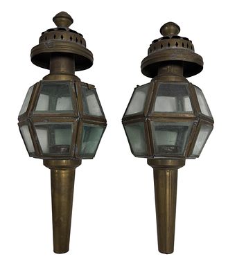 Pair of antique carriage lanterns, made of metal and glass. Height 0.36. One is dented.