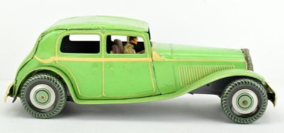 Vintage Mettoy Coupe Tin Wind-Up Toy Car Britain. Sedan wind-up toy made of lithographed tin in 