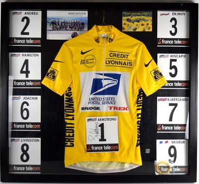 Lance Armstrong Jersey and Signed Number Display. Lance Armstrong jersey, rubber wristband and 