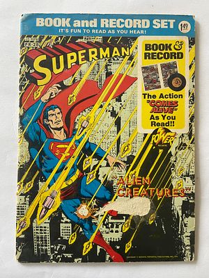 אספנות - קומיקס - יקום DC : סופרמן - חוברת קומיקס עם תקליט של SUPERMAN משנות ה70. בלאי סביר 