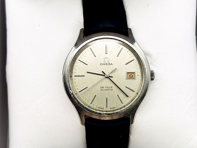 Zegarek męski Omega De Ville Quartz pomarańczowa data 35 mm. Zegarek stalowy, kwarcowy, z