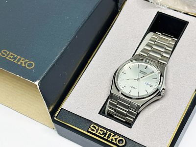 Zegarek męski Seiko SQ100 35 mm z oryginalnym pudłem Seiko. Zegarek stalowy, kwarcowy, DayDate 