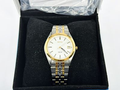 Zegarek męski Seiko SQ50 37 mm z pudełkiem Seiko i papierami. Zegarek stalowy z pozłacanymi 